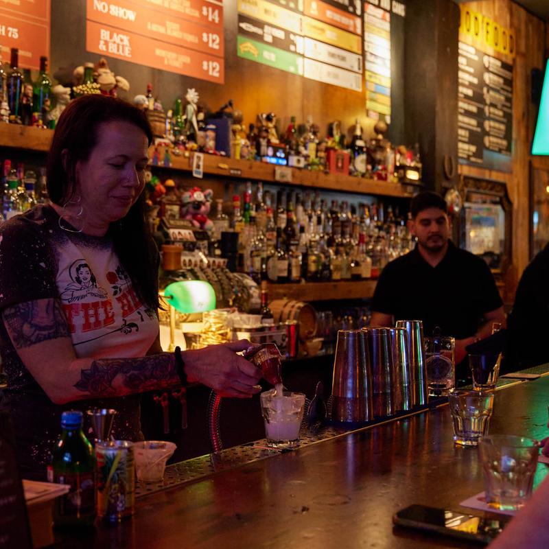 Bartender mixing a drink at the bar
