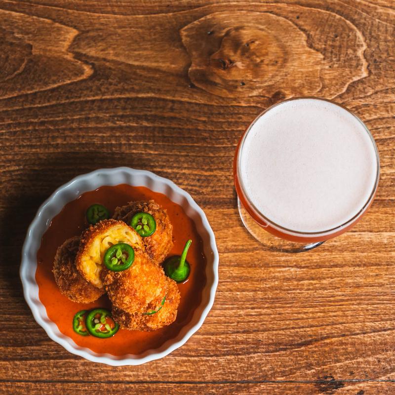 Jalapeno Mac and Cheese Balls served with a cocktail
