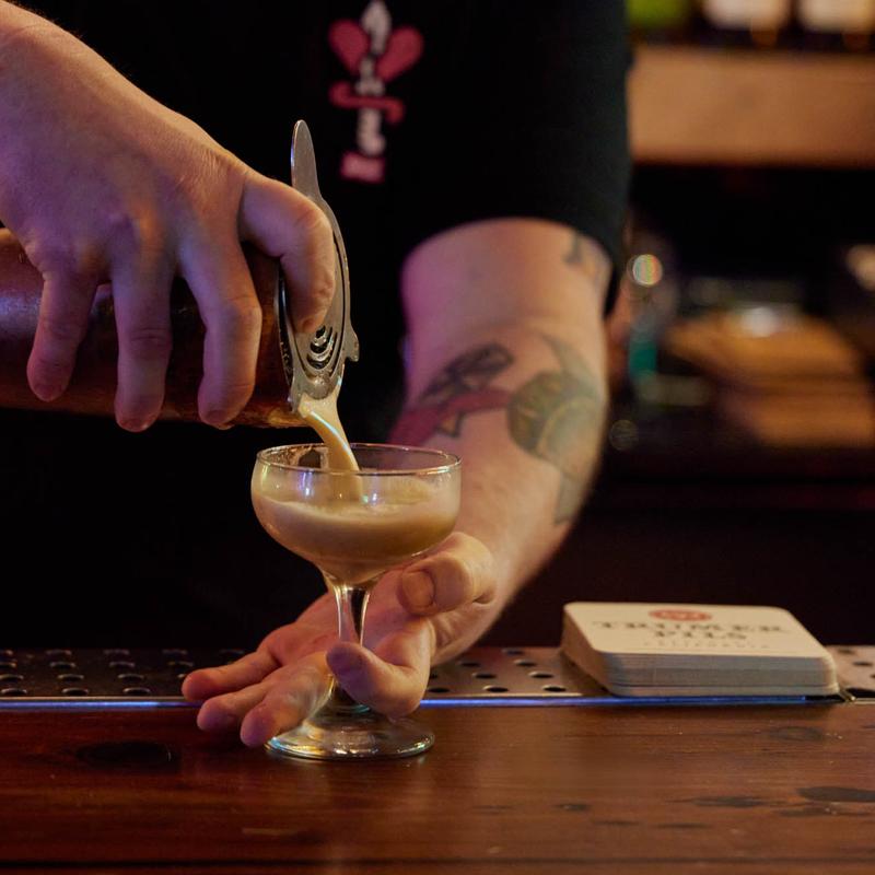 Bartender making cocktail close up