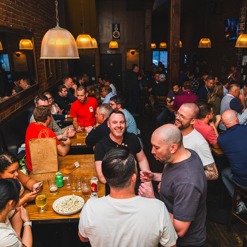 People socializing in a crowded bar
