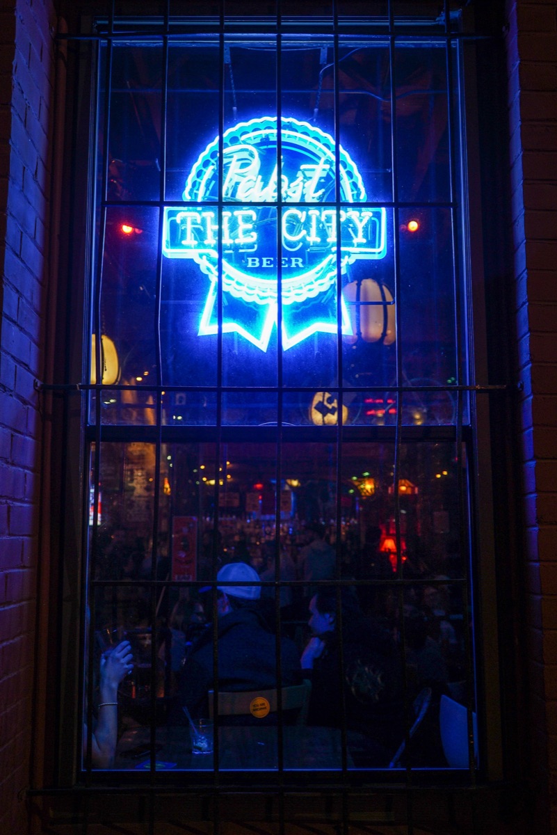 The Pabst “The City” neon glowing in Tempest's front window at night