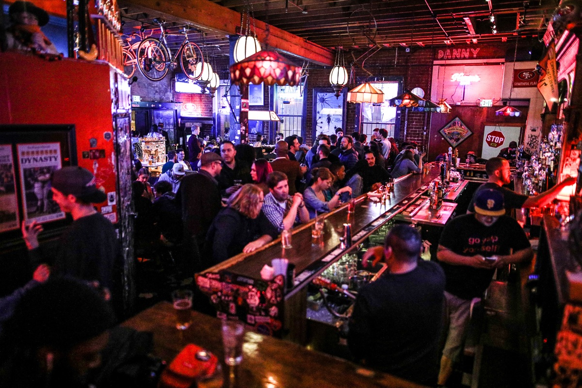 A packed Friday crowd along the full length of the bar